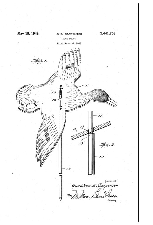 Patent drawing of a flat, plywood duck decoy shaped like a duck with outstretched wings and lowered feet as if landing, mounted on a vertical stake that passes through an angled hole in its body, with a detail cross-section showing the stake's reduced upper end and shoulder.